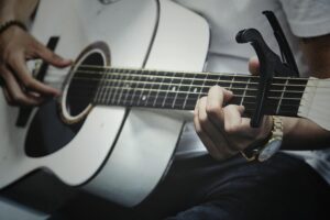 A guitar with a capo fitted.